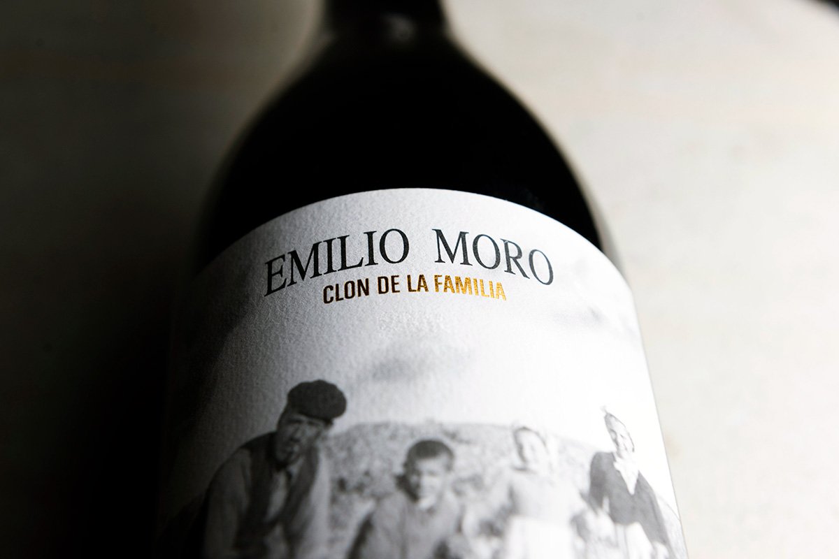 A bottle of Clon de la Familia wine laying down.