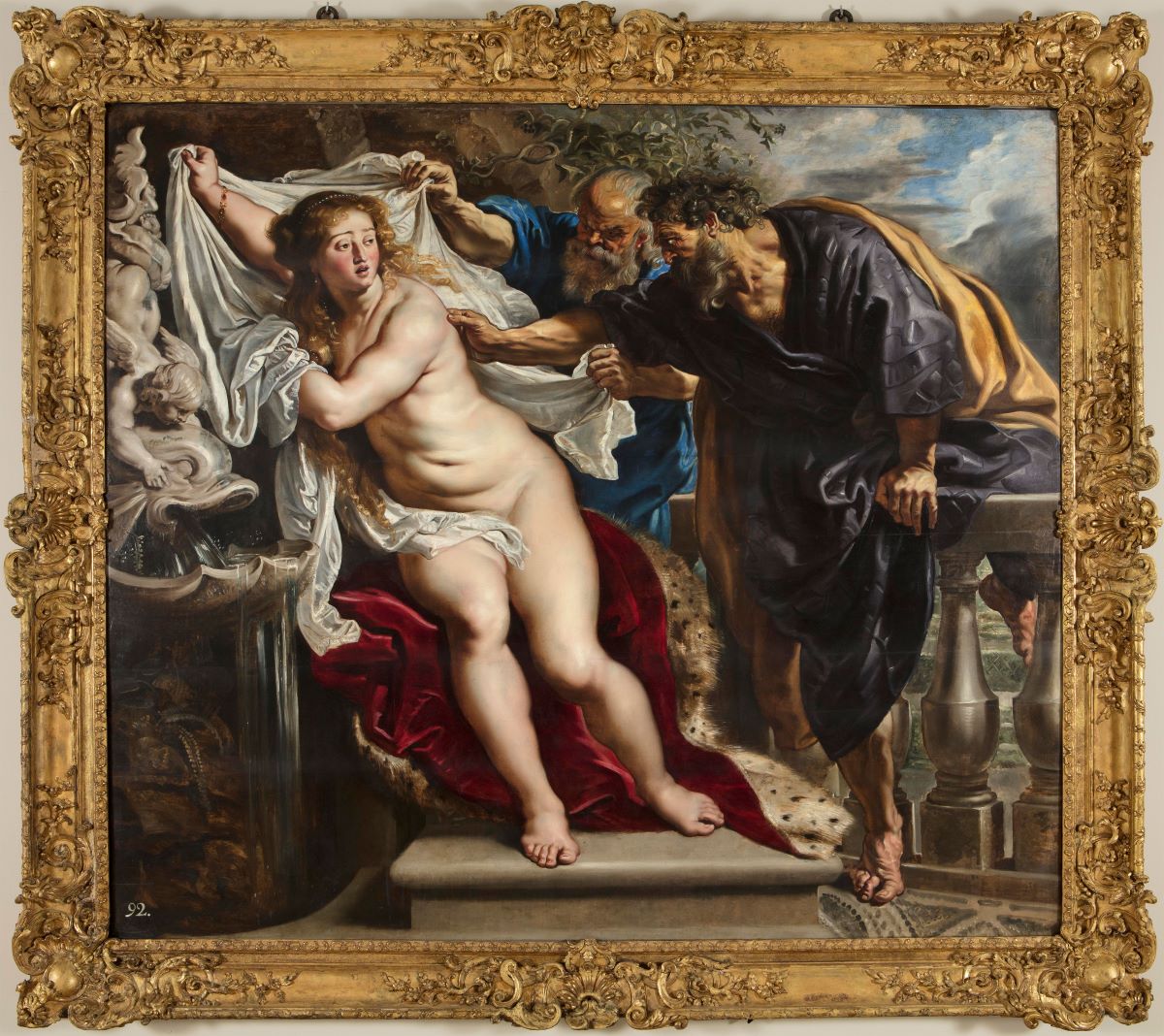Susanna and the elders, a baroque painting by Rubens. It depicts a dramatic biblical scene where a nude woman, Susanna, attempts to cover herself with a white cloth while being harassed by two older men.