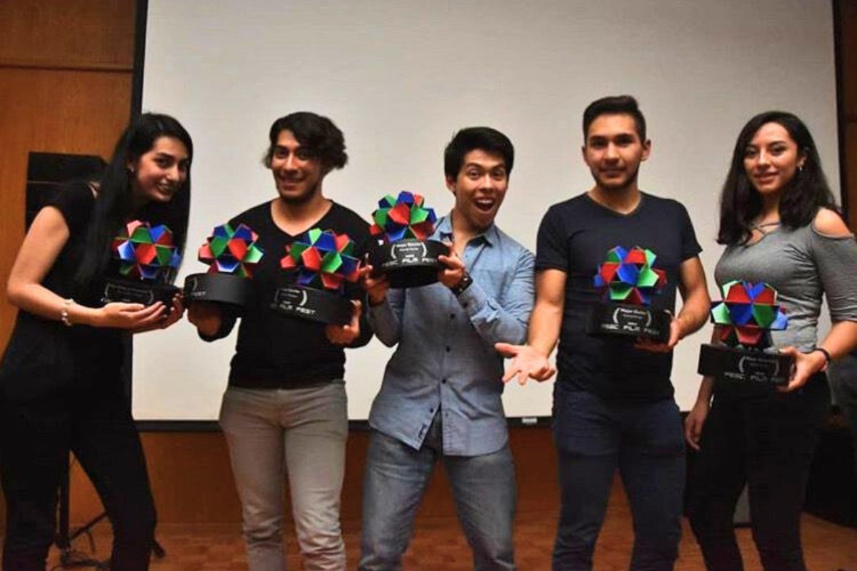 Joel Celaya receives an award at the FEST film festival.