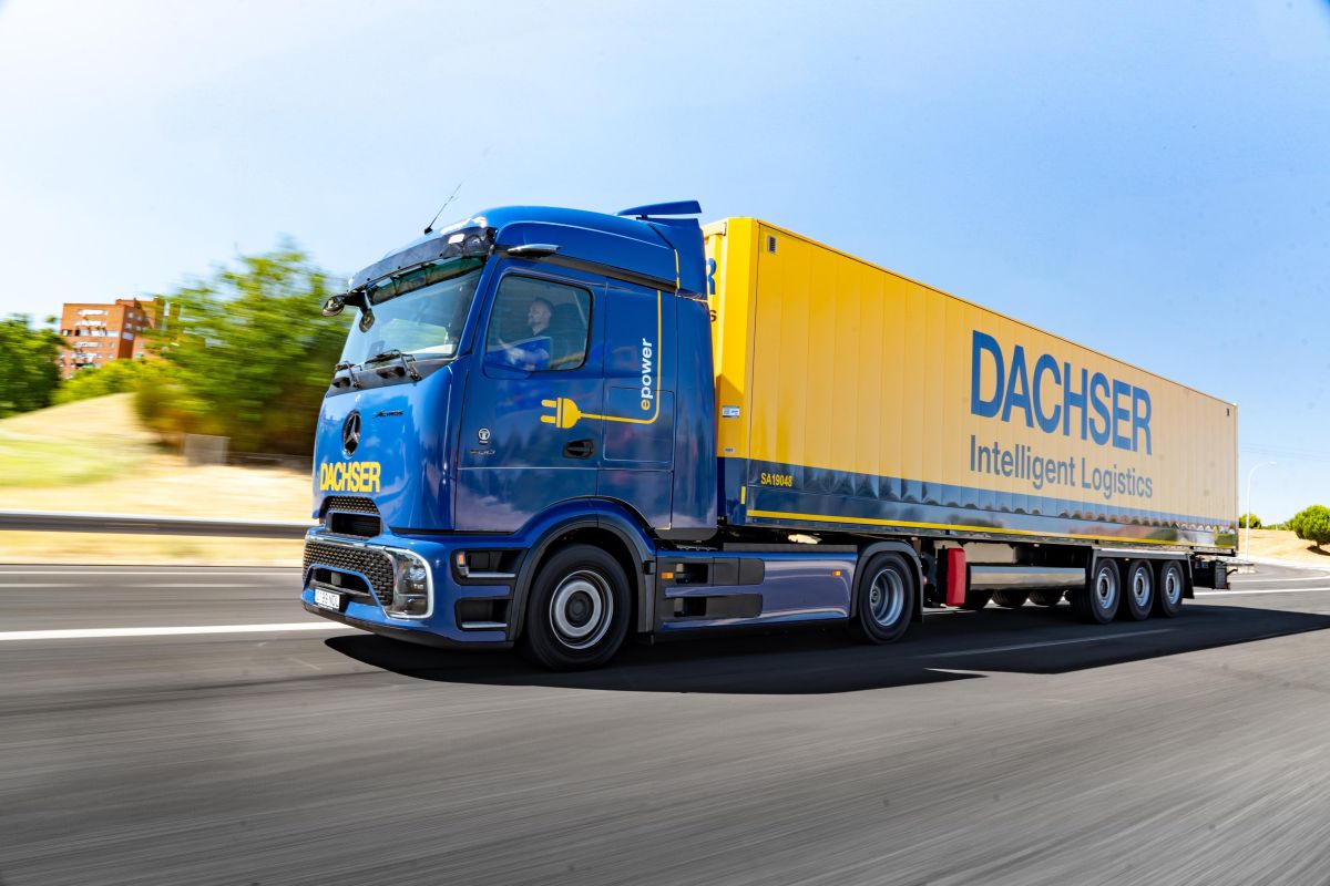 An electric truck from Dachser manufactured by Mercedes-Benz on the road.