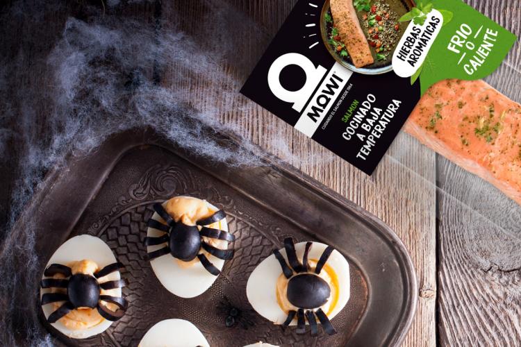 Halloween decorated salmon deviled eggs.