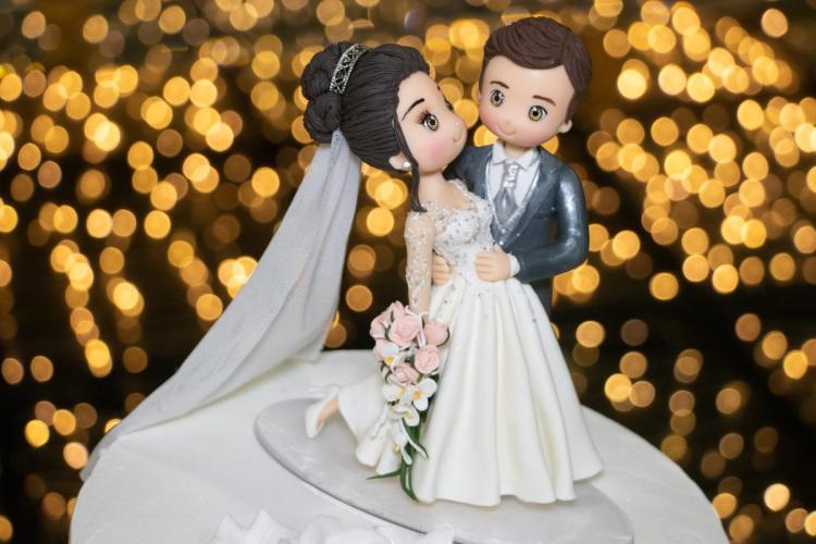 Biscuit dolls as decoration for a wedding cake.