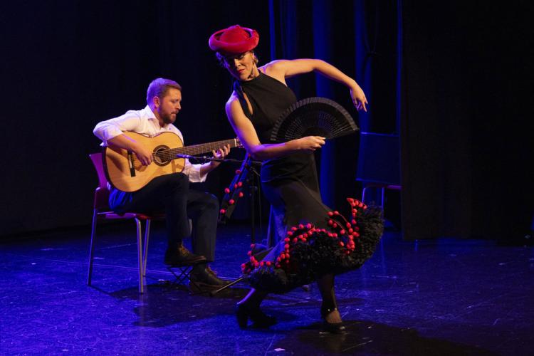 Patricia Guerrero, dancing, and Alejandro Hurtado, playing guitar, on stage. Photograph by Anna Palma.