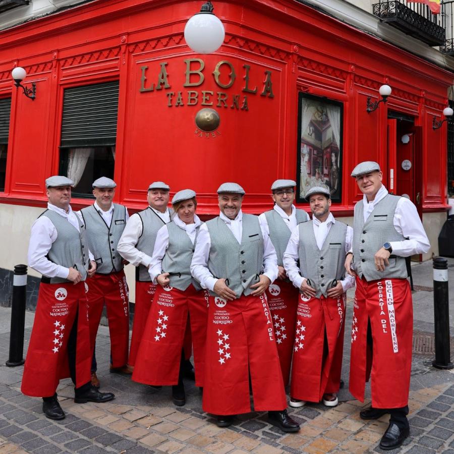Members of the Cofradía del Cocido Madrileño in front of the La Bola restaurant, famous for its stews.